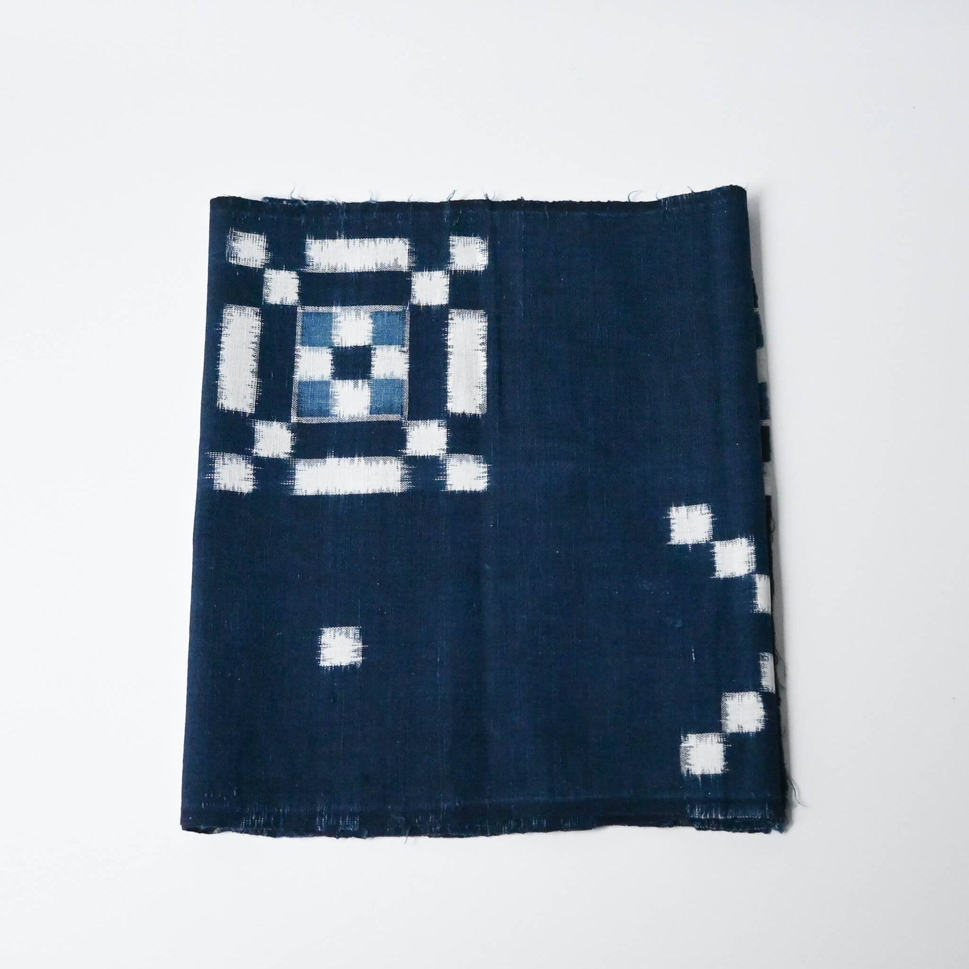 Vintage Japanese indigo kasuri cotton panel from San'in region, a simple geometric pattern.