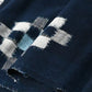 Close-up view of vintage Japanese indigo kasuri cotton panel from San'in region, a simple geometric pattern.