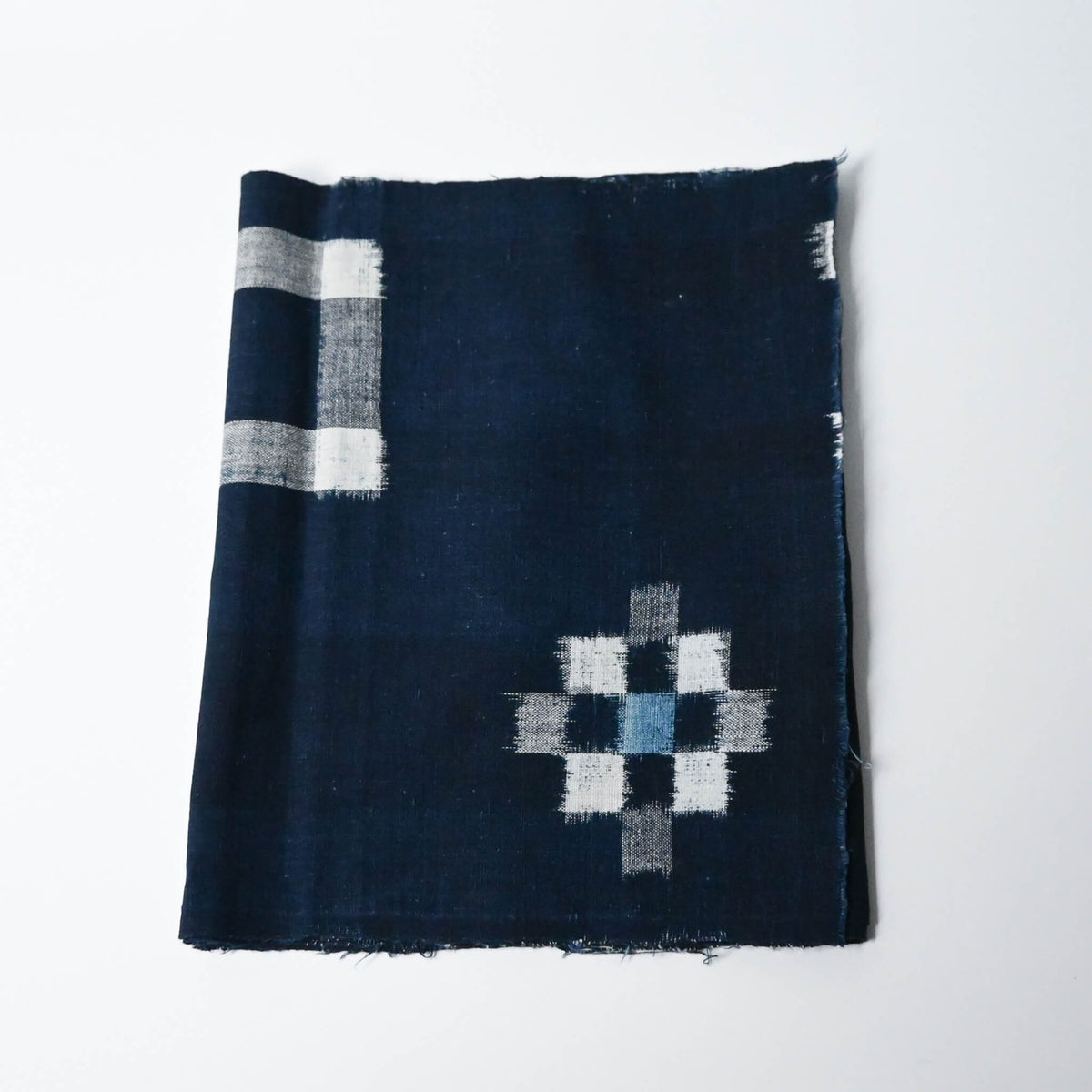 Vintage Japanese indigo kasuri cotton panel from San'in region, a simple geometric pattern.