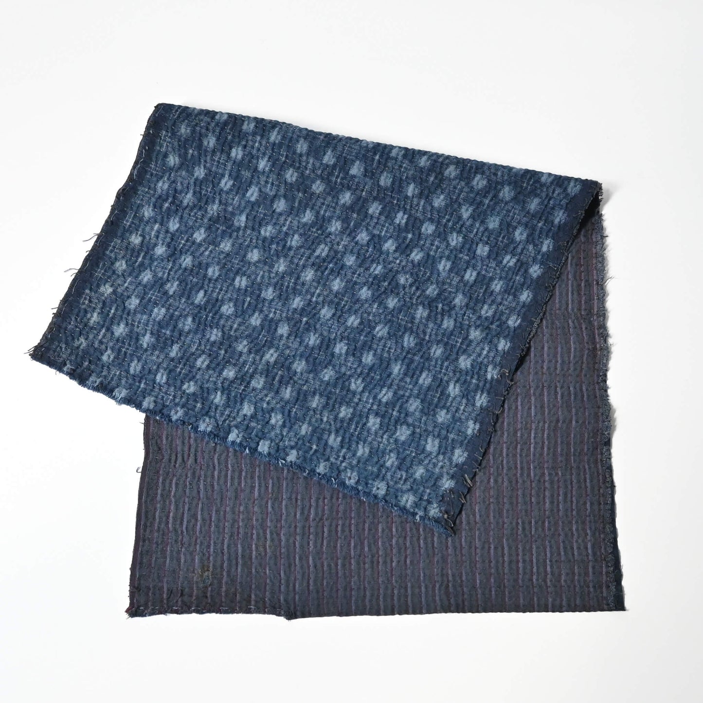 Fragment of vintage indigo kasuri cotton with all-over sashiko stitch with soft feel.