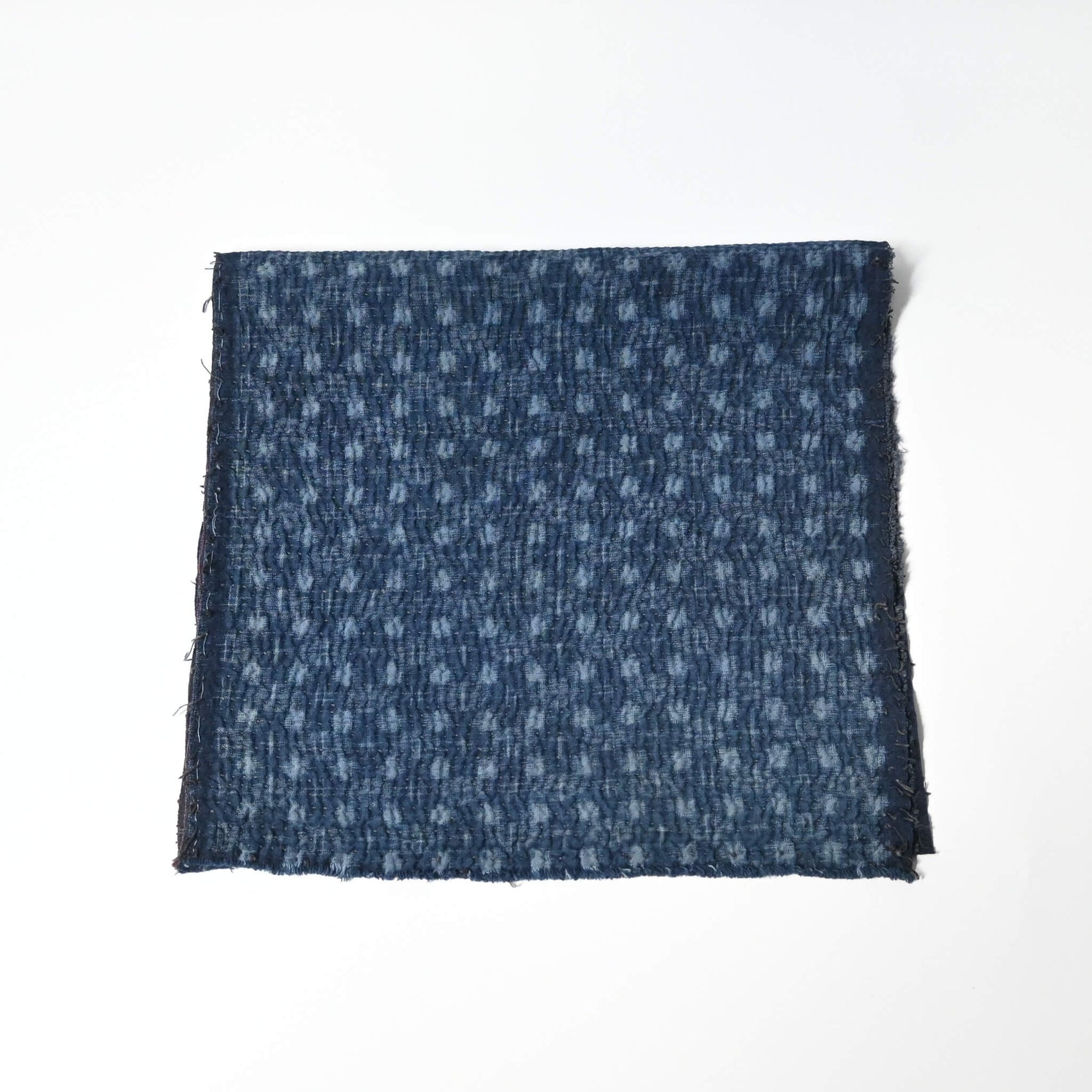 Fragment of vintage indigo kasuri cotton with all-over sashiko stitch with soft feel.
