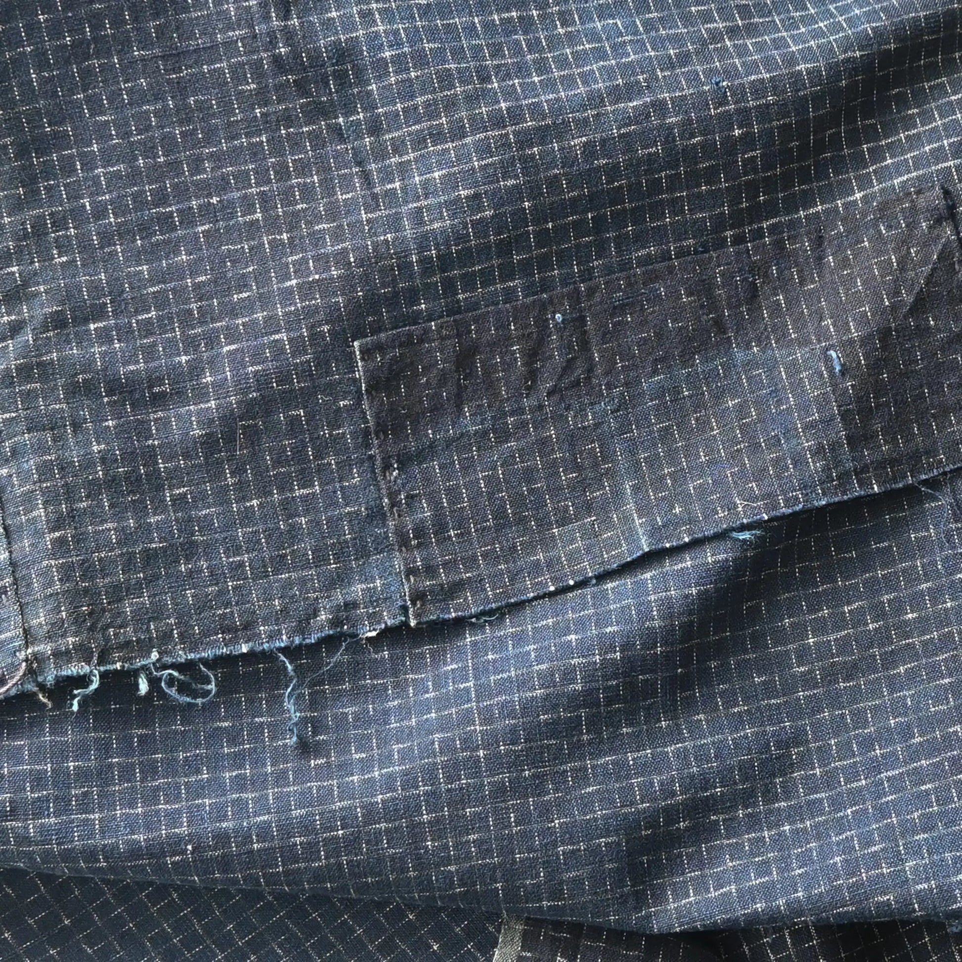 Detailed view of vintage four-panel indigo cotton futon cover with subtle Kasuri pattern from 20th century.