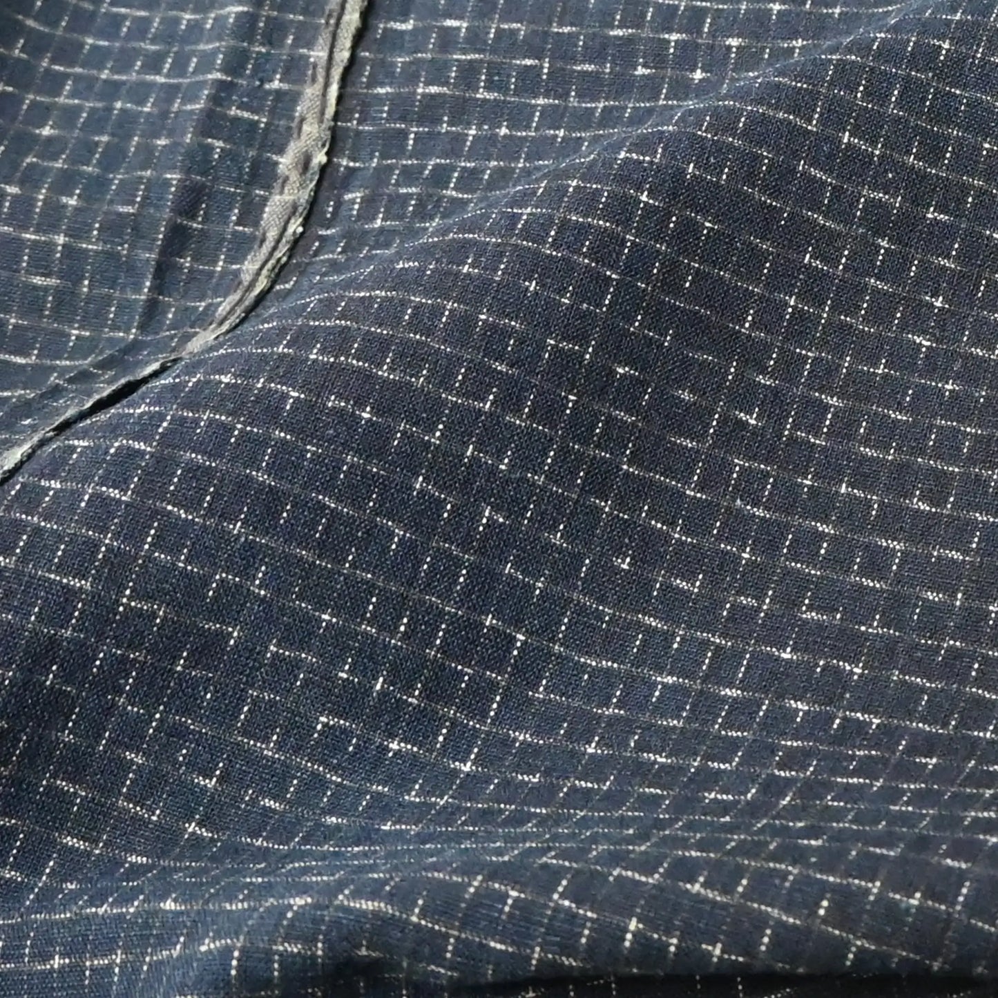Detailed view of vintage four-panel indigo cotton futon cover with subtle Kasuri pattern from 20th century.