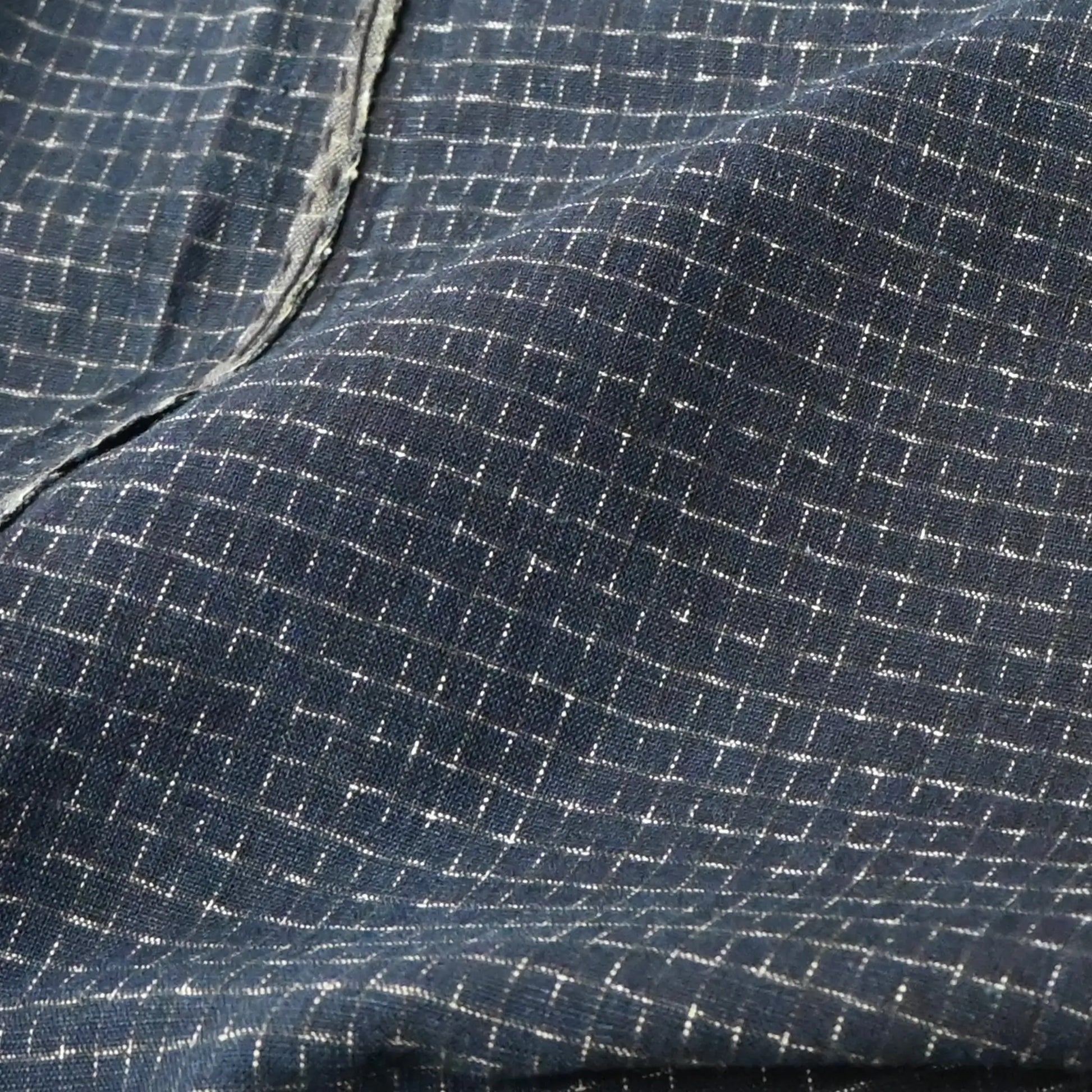 Detailed view of vintage four-panel indigo cotton futon cover with subtle Kasuri pattern from 20th century.