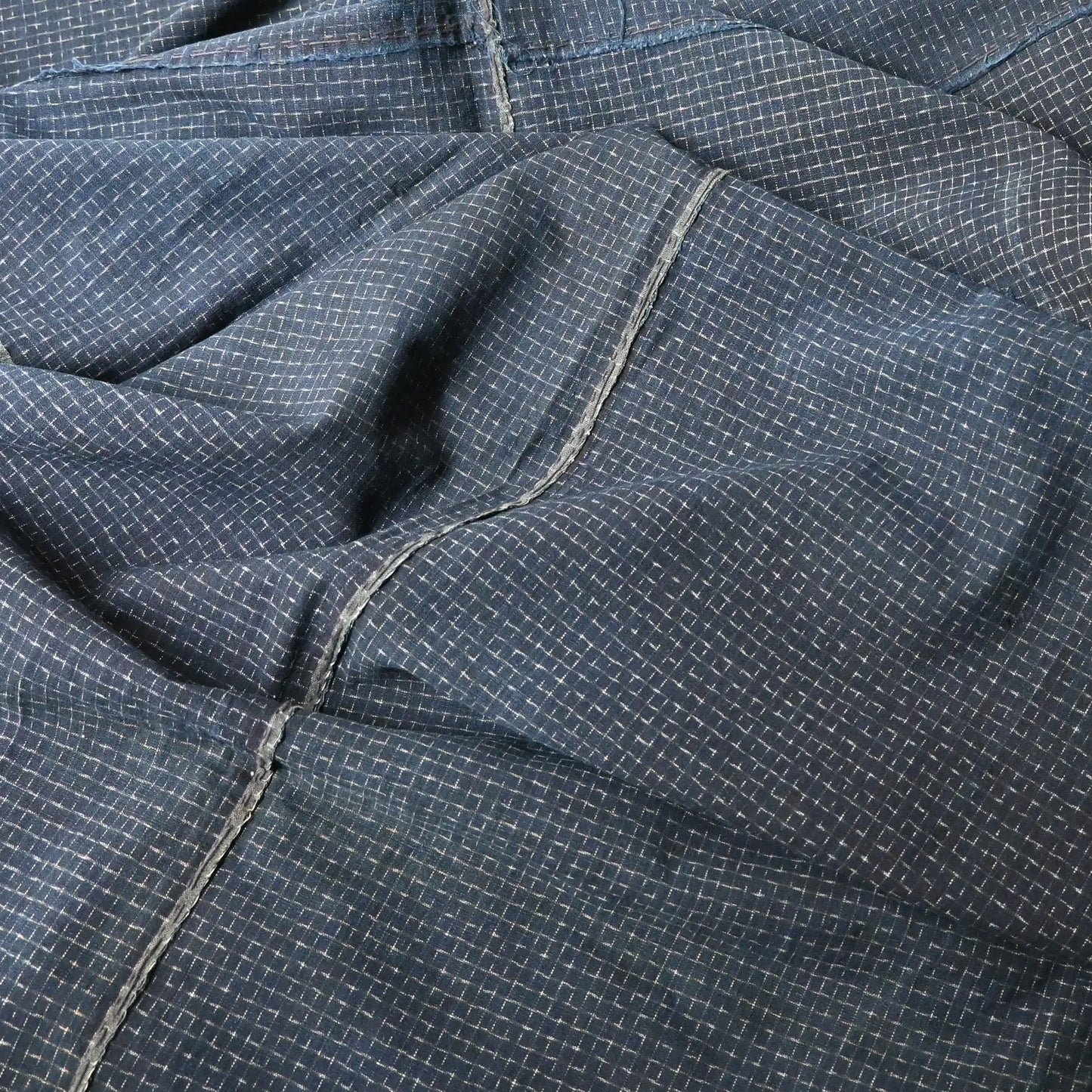 Detailed view of vintage four-panel indigo cotton futon cover with subtle Kasuri pattern from 20th century.