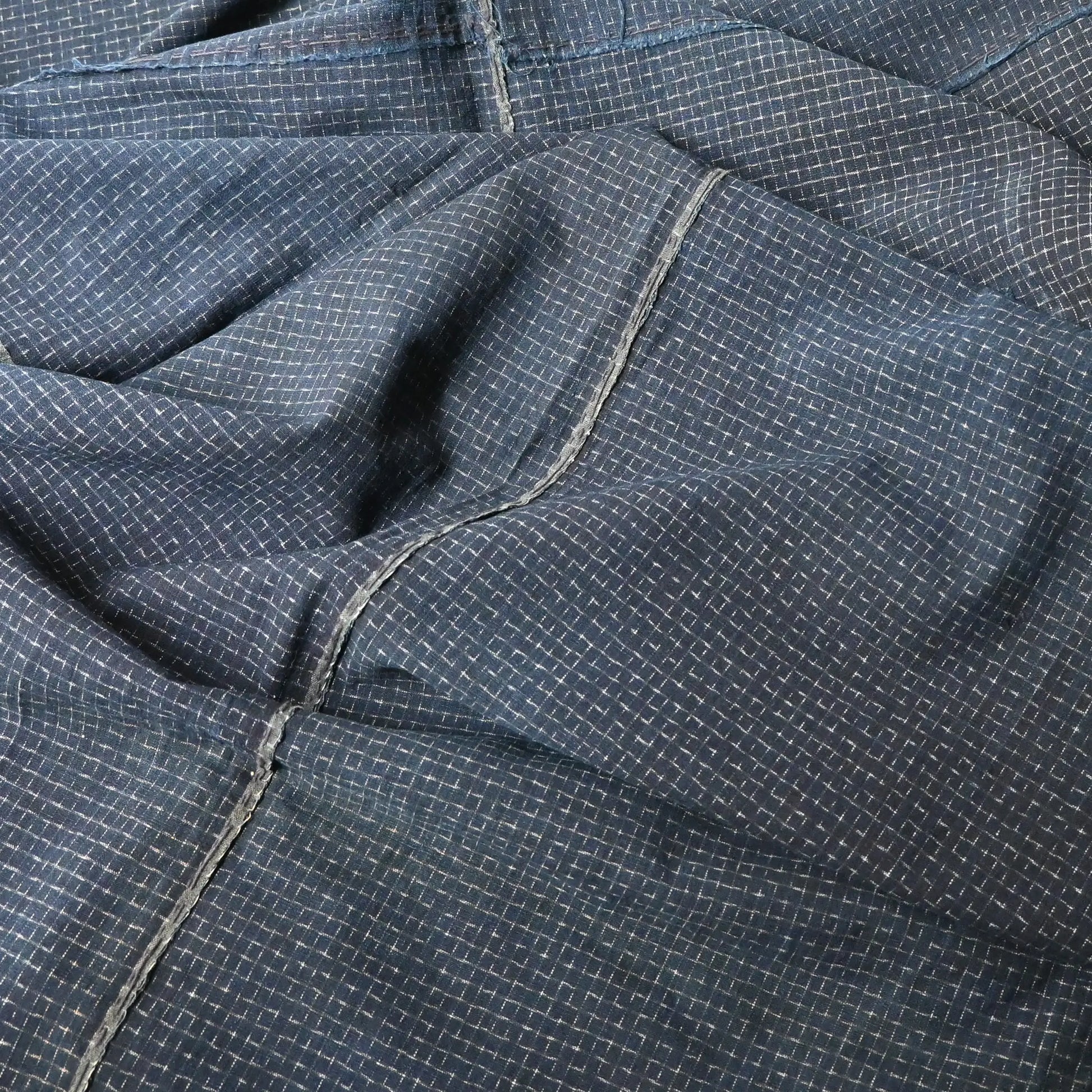 Detailed view of vintage four-panel indigo cotton futon cover with subtle Kasuri pattern from 20th century.