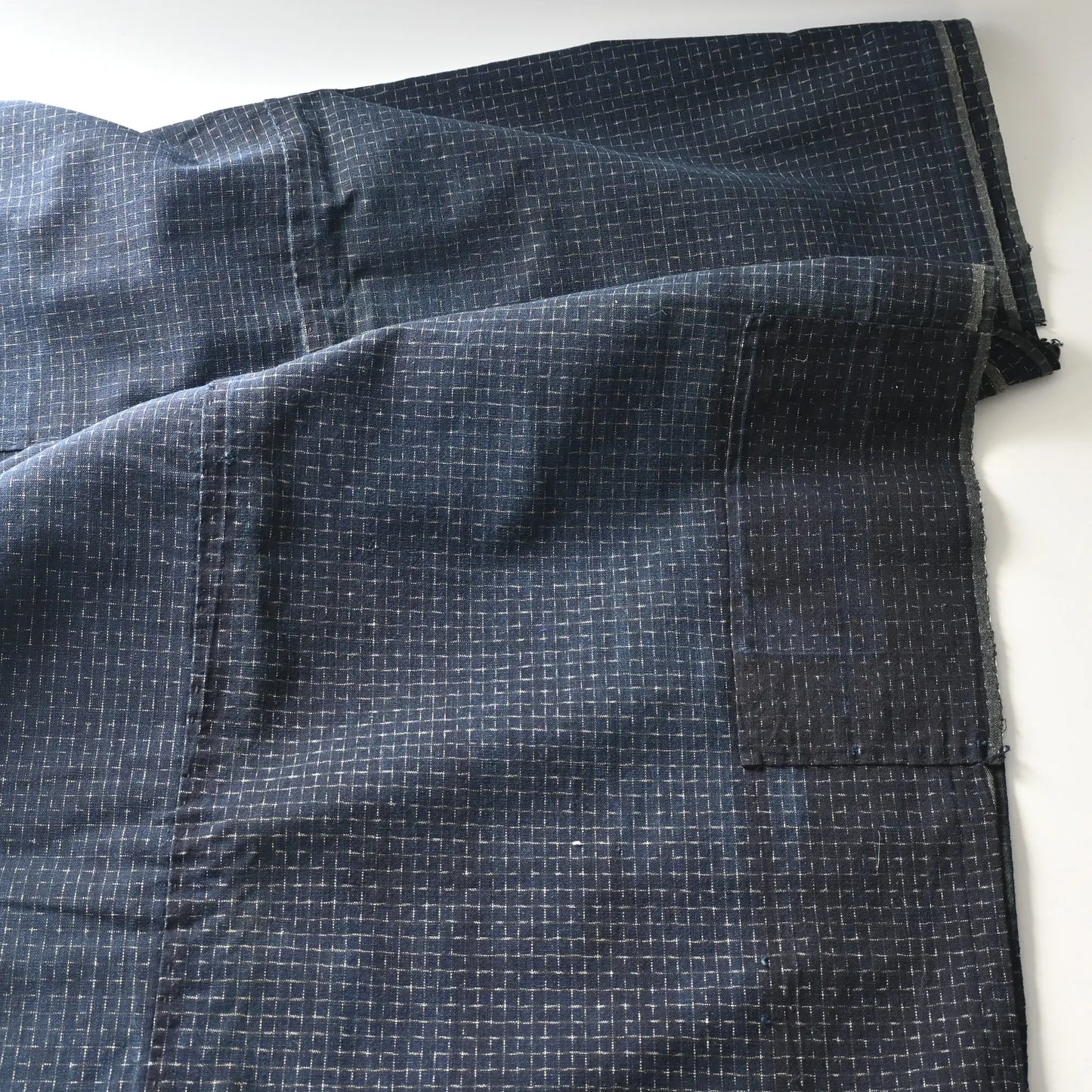 Detailed view of vintage four-panel indigo cotton futon cover with subtle Kasuri pattern from 20th century.