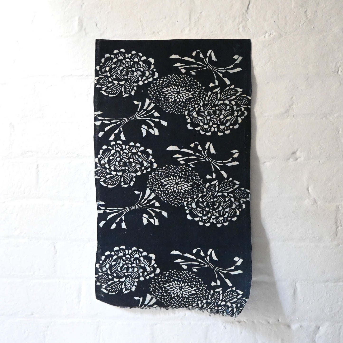 Full view of vintage indigo katazome cotton fragment with peony, chrysanthemum and noshi paper motifs.