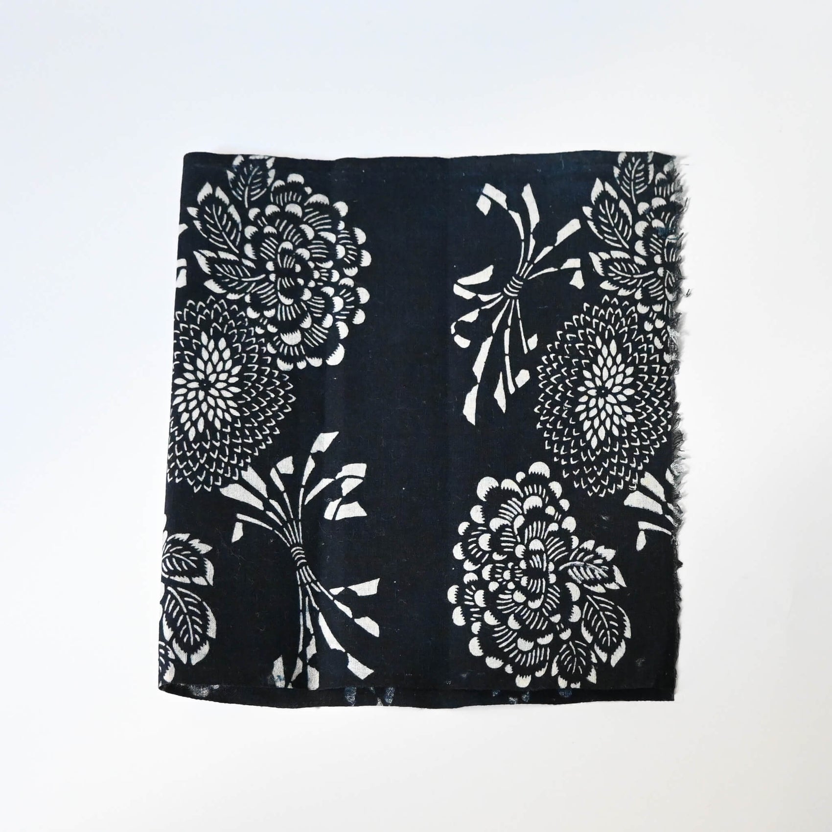 Vintage indigo katazome cotton fragment with peony, chrysanthemum and noshi paper motifs.