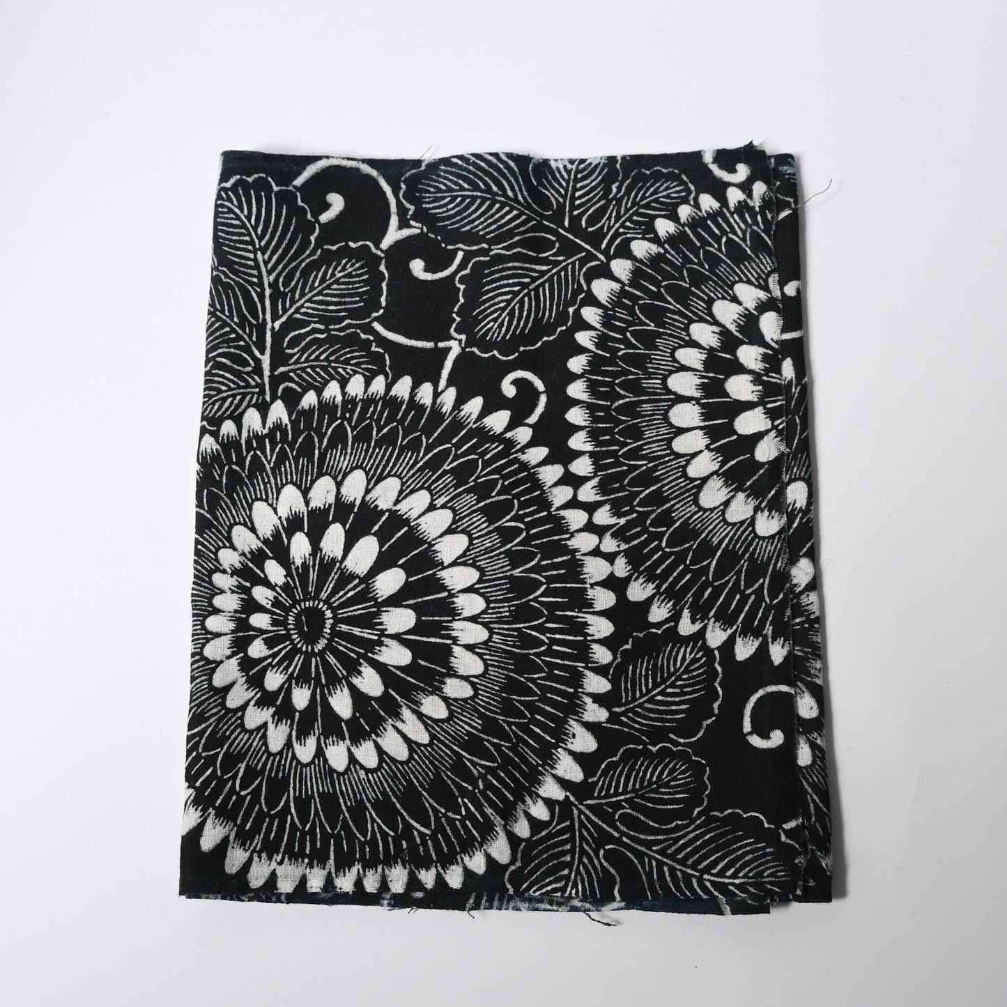 Vintage indigo katazome stencil dyed cotton piece with a bold chrysanthemum design.