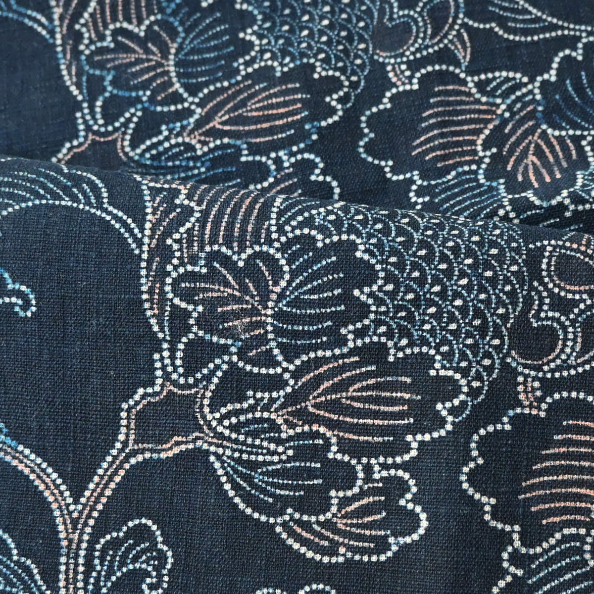 Detailed view of vintage Japanese indigo katazome dyed cotton piece with large peony motif with subtle red accents.