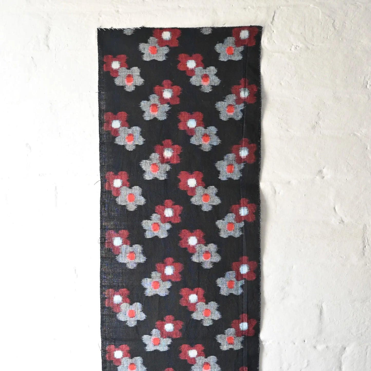 Hanging view of vintage indigo Kurume kasuri cotton with rare plum blossom pattern from the mid-20th century.