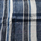 Close-up of vintage Japanese indigo plaid cotton futon cover with some small mended patches.