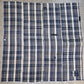 Full view of vintage Japanese indigo plaid cotton futon cover with some small mended patches.