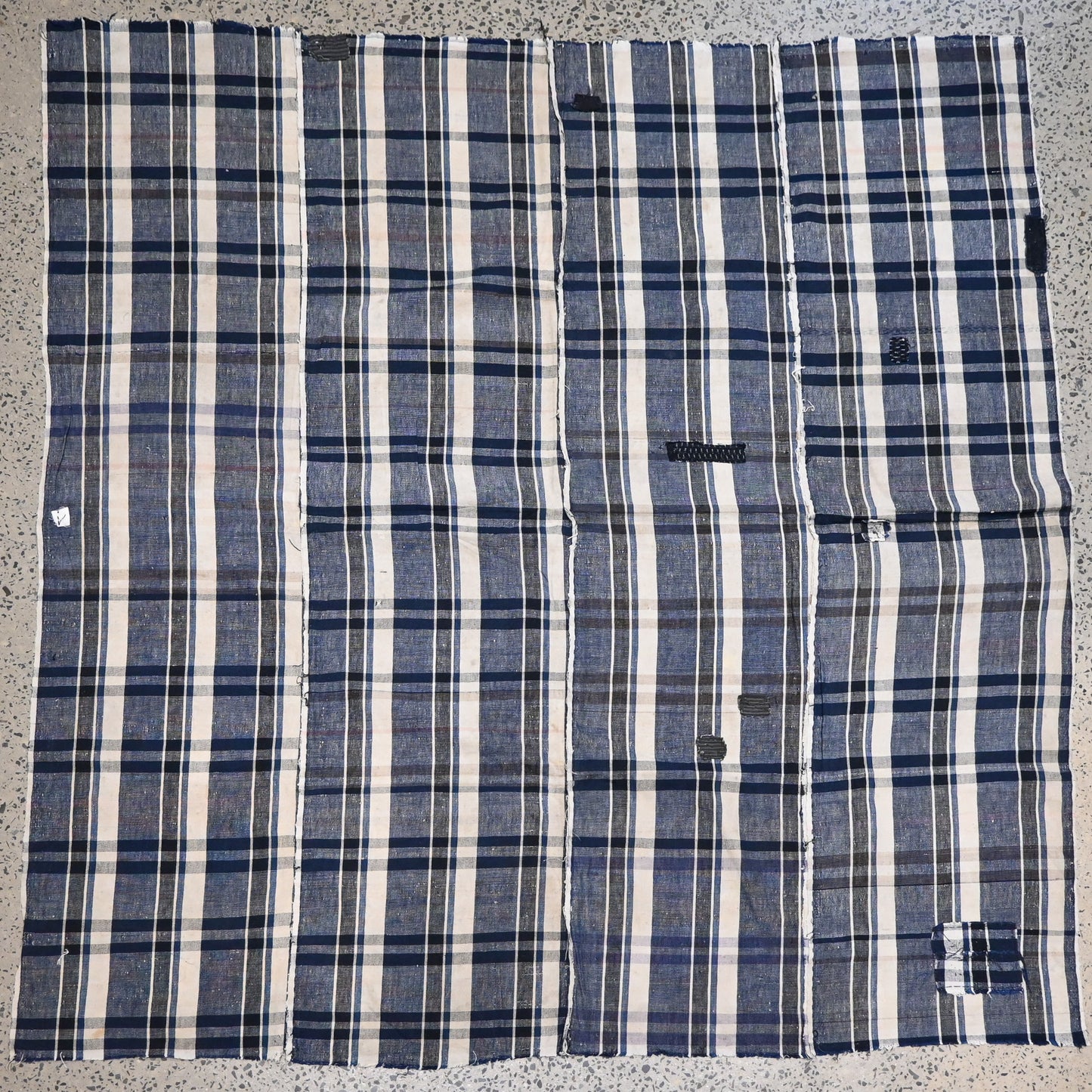Full view of vintage Japanese indigo plaid cotton futon cover with some small mended patches.