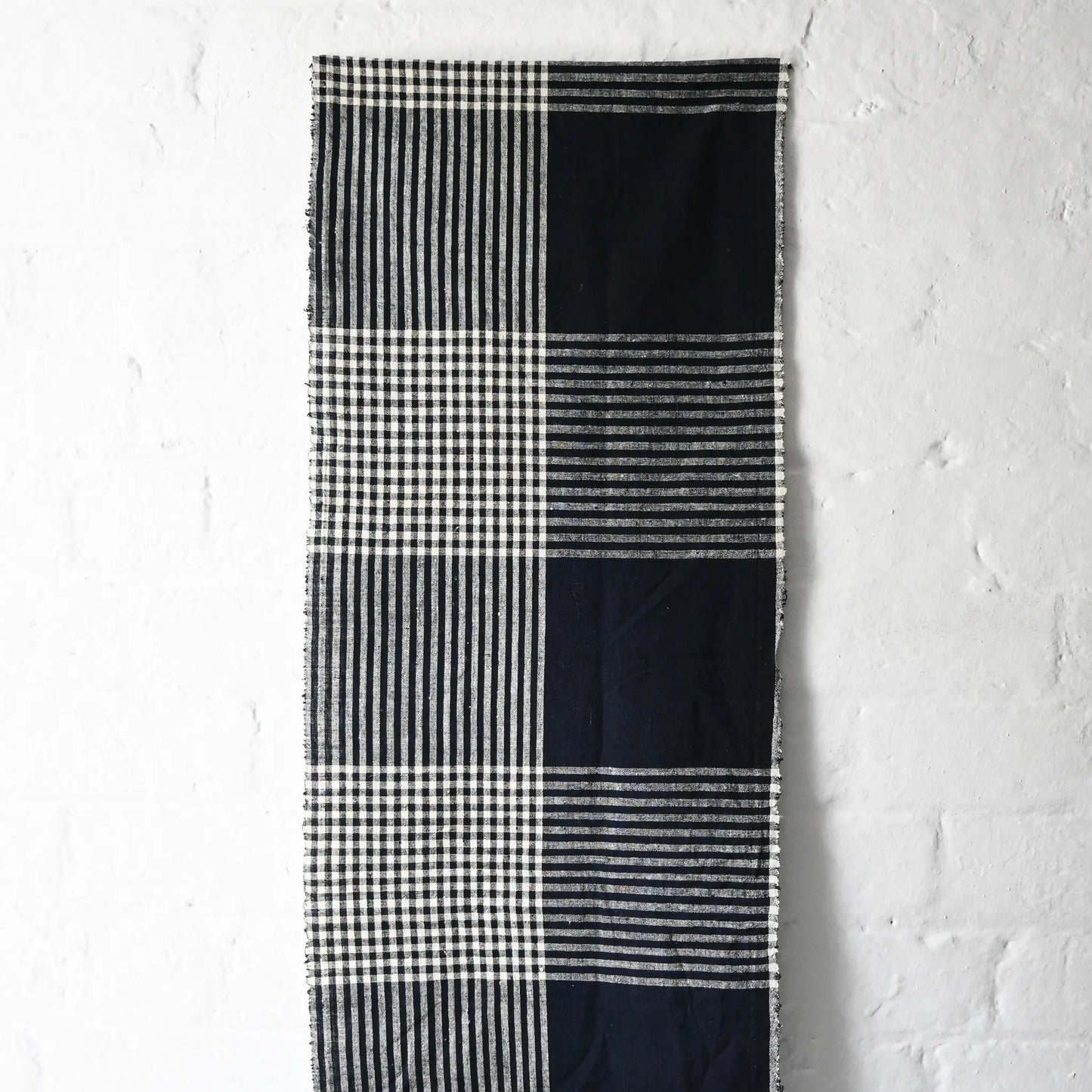 Hanging view of vintage indigo striking check cotton futon cover panel from the mid-20th century.