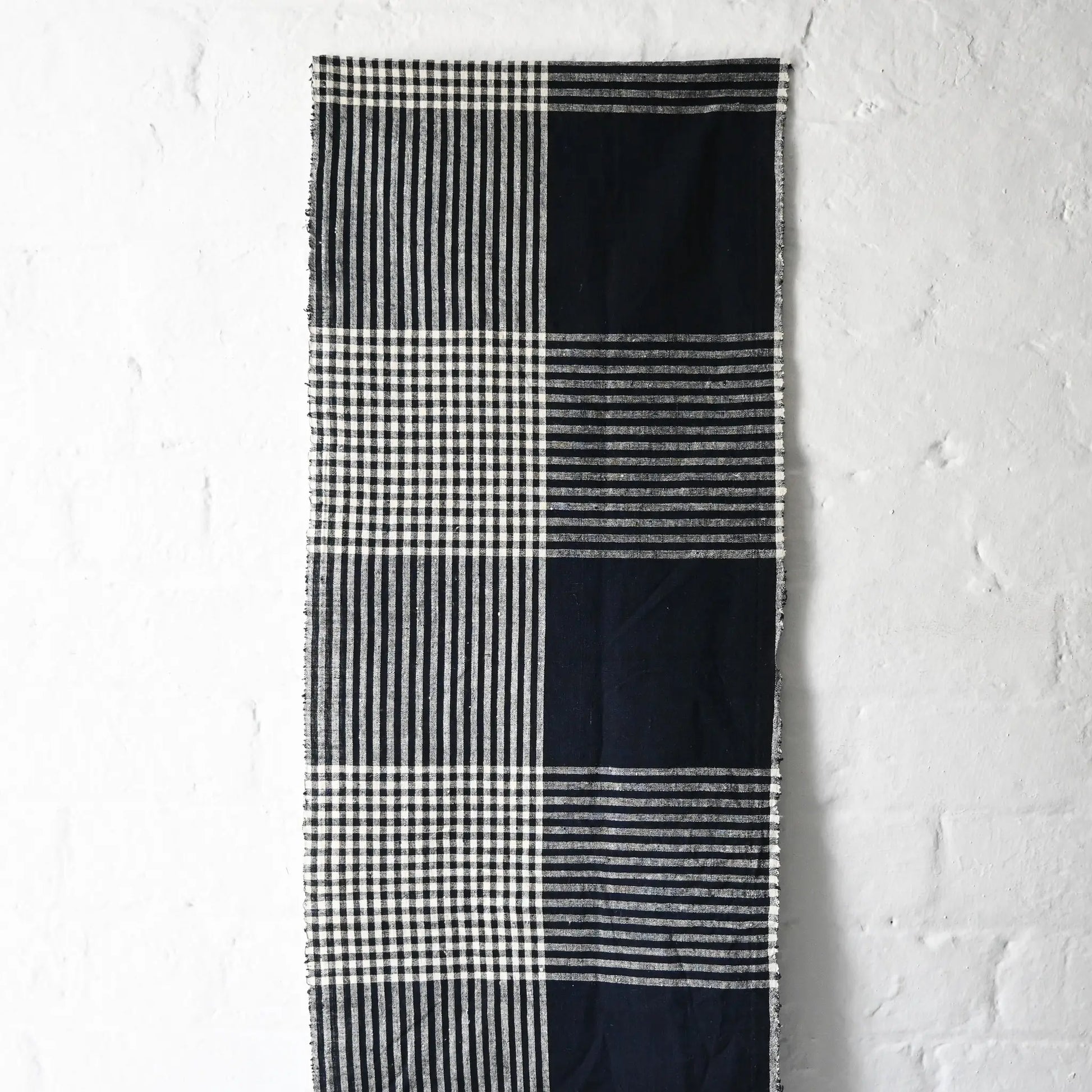 Hanging view of vintage indigo striking check cotton futon cover panel from the mid-20th century.