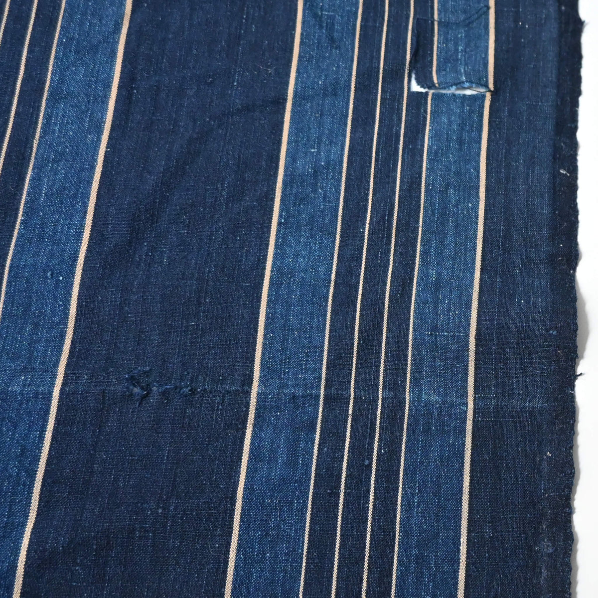 Detail view of vintage Japanese indigo stripe cotton from futon cover.