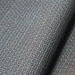 Close-up of vintage men's kimono silk fabric roll in black with blue woven Kikko hexagon motif.