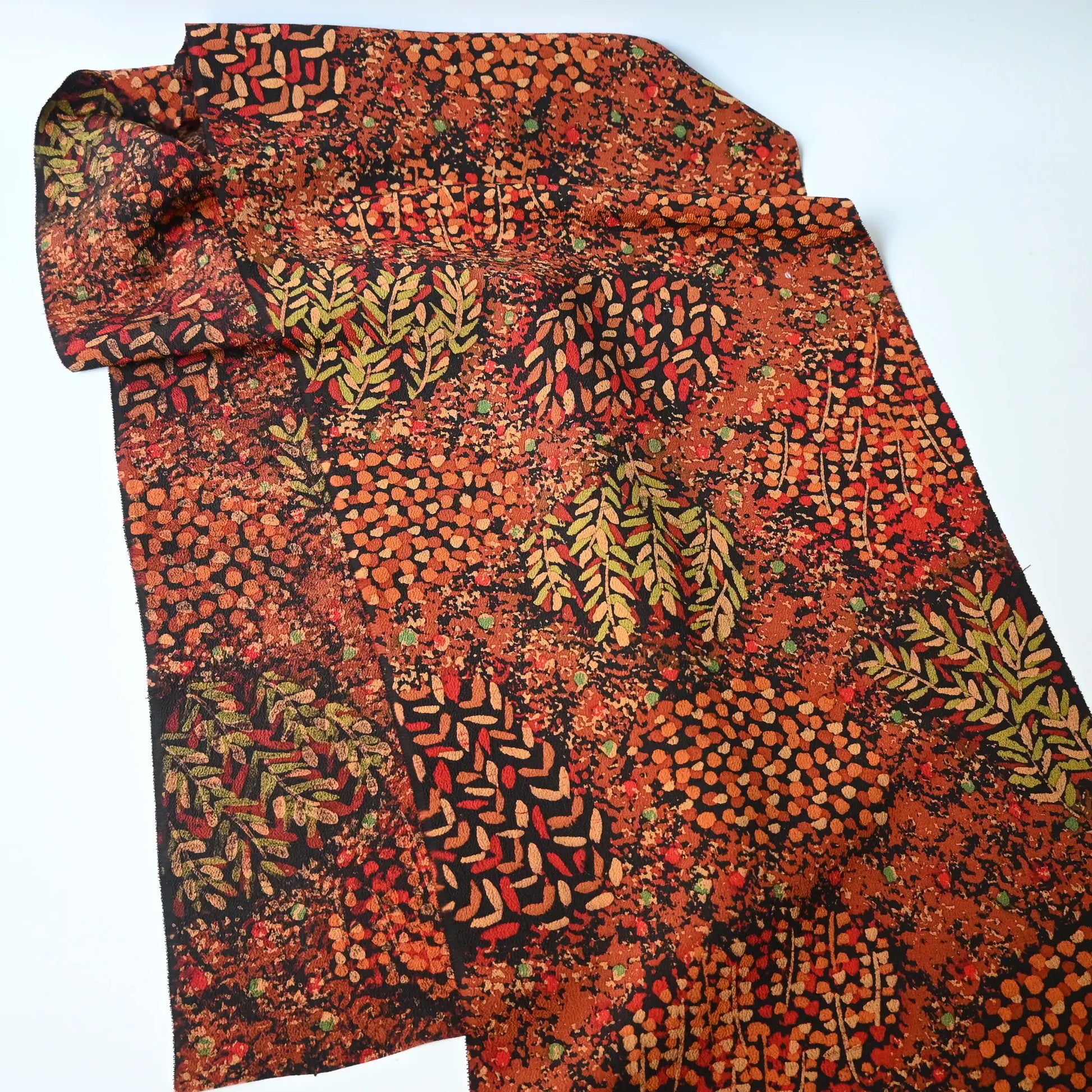 Full view of vintage Japanese autumn colour palette heavy silk crepe kimono fabric with a botanical pattern.