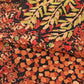 Detailed view of vintage Japanese autumn colour palette heavy silk crepe kimono fabric with a botanical pattern.