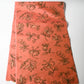 Full view of vintage Japanese coral pink Mensen kimono silk fabric with abstract floral pattern from the mid-20th century.