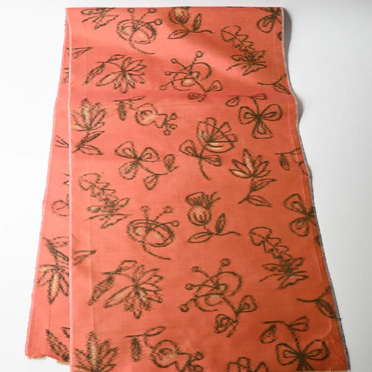 Full view of vintage Japanese coral pink Mensen kimono silk fabric with abstract floral pattern from the mid-20th century.