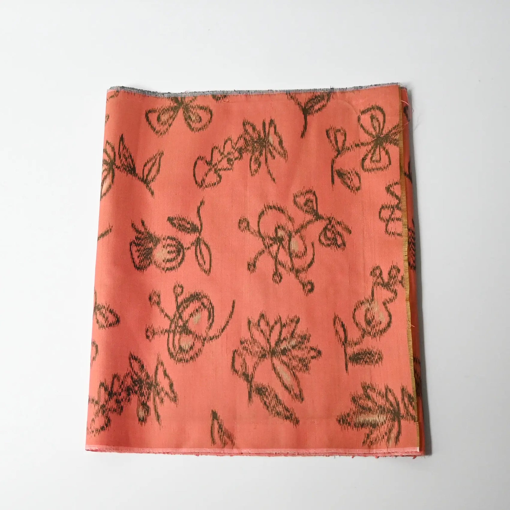 Vintage Japanese coral pink Mensen kimono silk fabric with abstract floral pattern from the mid-20th century.