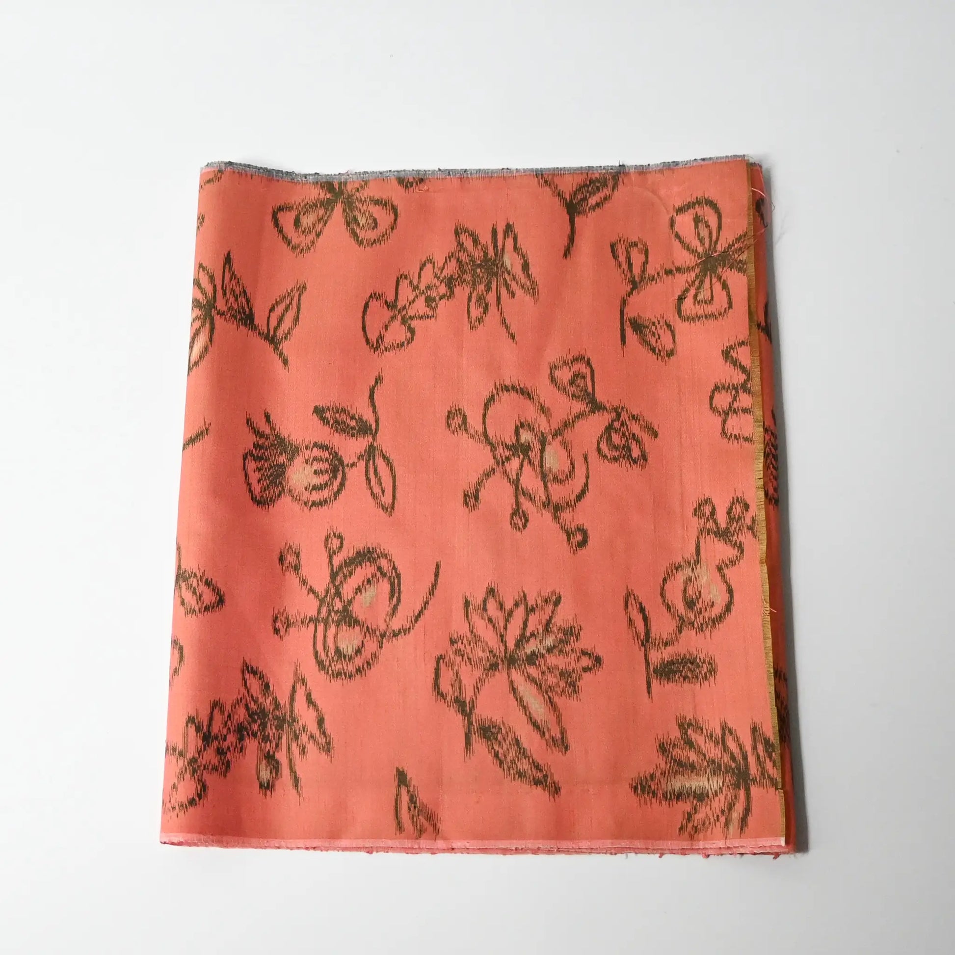 Vintage Japanese coral pink Mensen kimono silk fabric with abstract floral pattern from the mid-20th century.