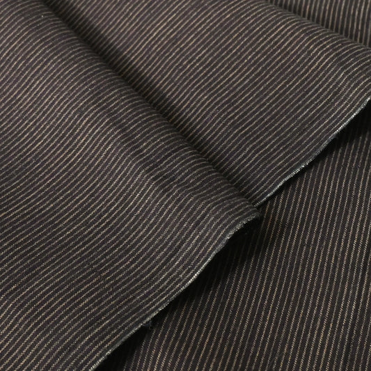 Detailed view of vintage Japanese indigo woven cotton piece with khaki brown pinstripes from the mid-20th century.