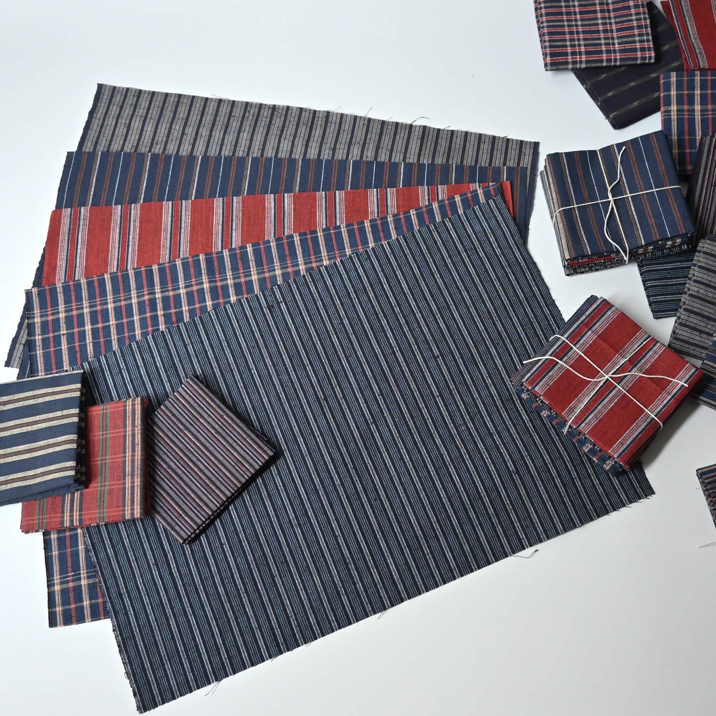 Set of five vintage Japanese cotton kimono fabric pieces in assorted checks and stripes.