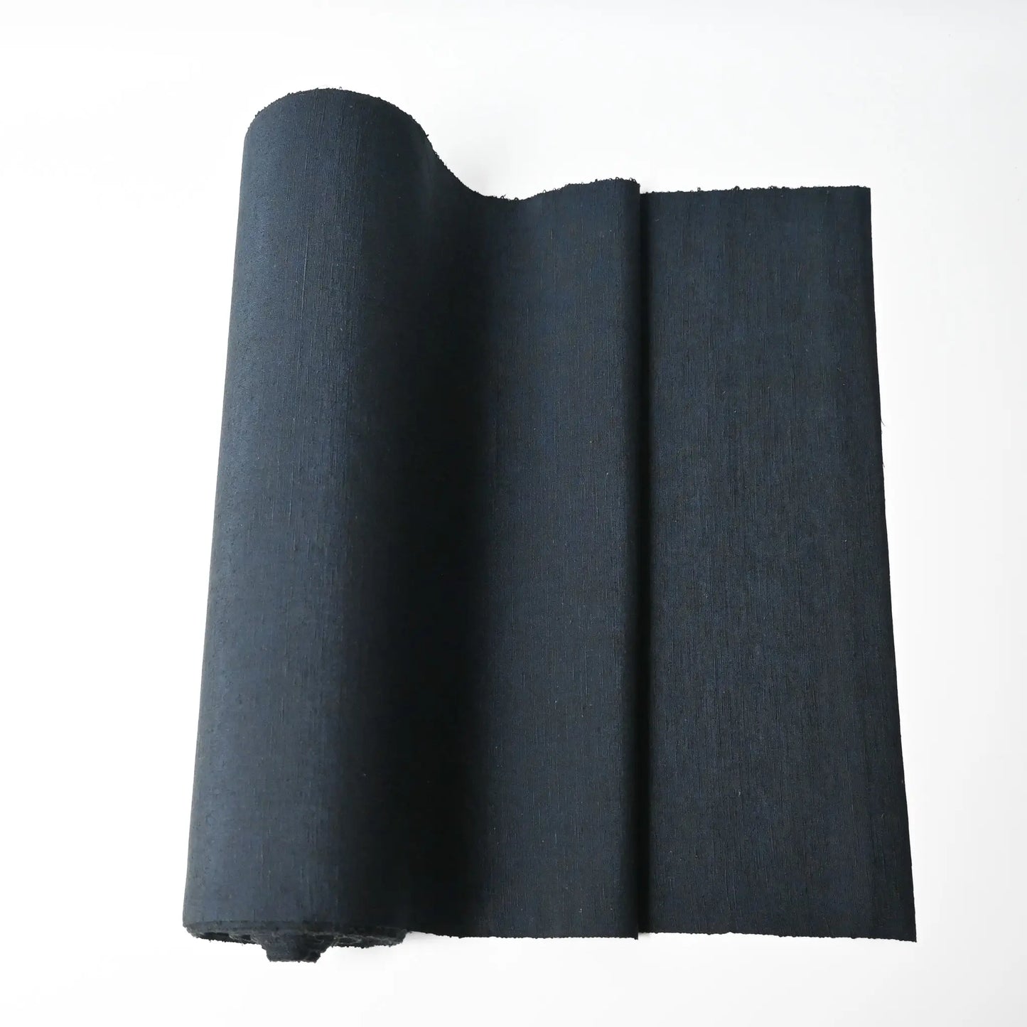 Vintage dead stock men's tsumugi silk kimono fabric roll in dark sea tone.