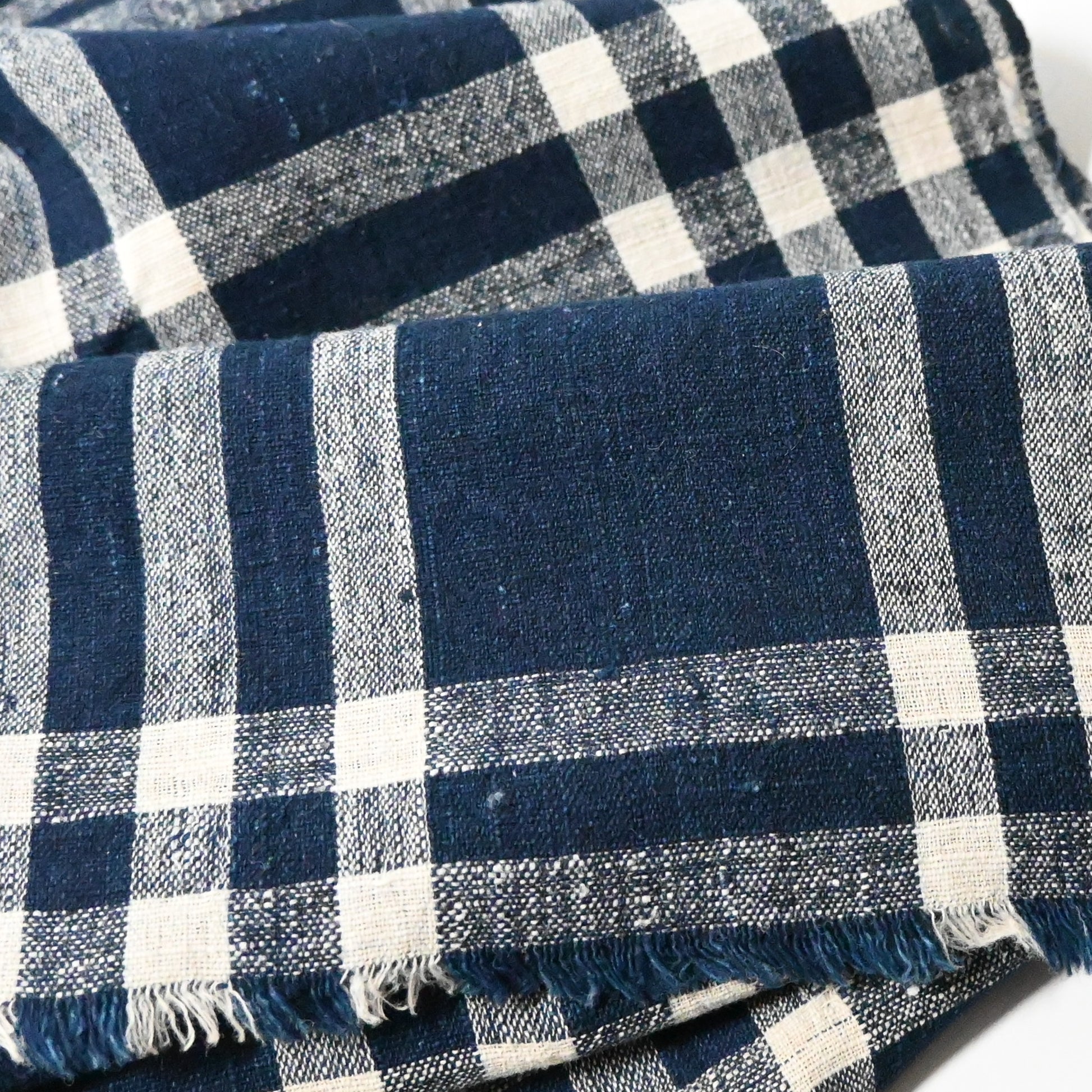Detailed view of vintage Japanese hand loomed indigo check cotton futon cover panel.