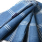 Close-up view of vintage Japanese indigo check cotton, boro mended piece from an old futon cover.