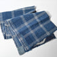 Full view of vintage Japanese indigo check cotton, boro mended piece from an old futon cover.