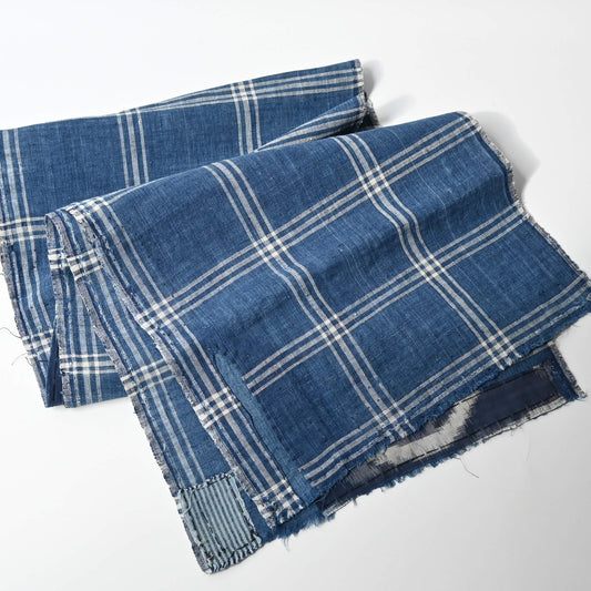 Full view of vintage Japanese indigo check cotton, boro mended piece from an old futon cover.