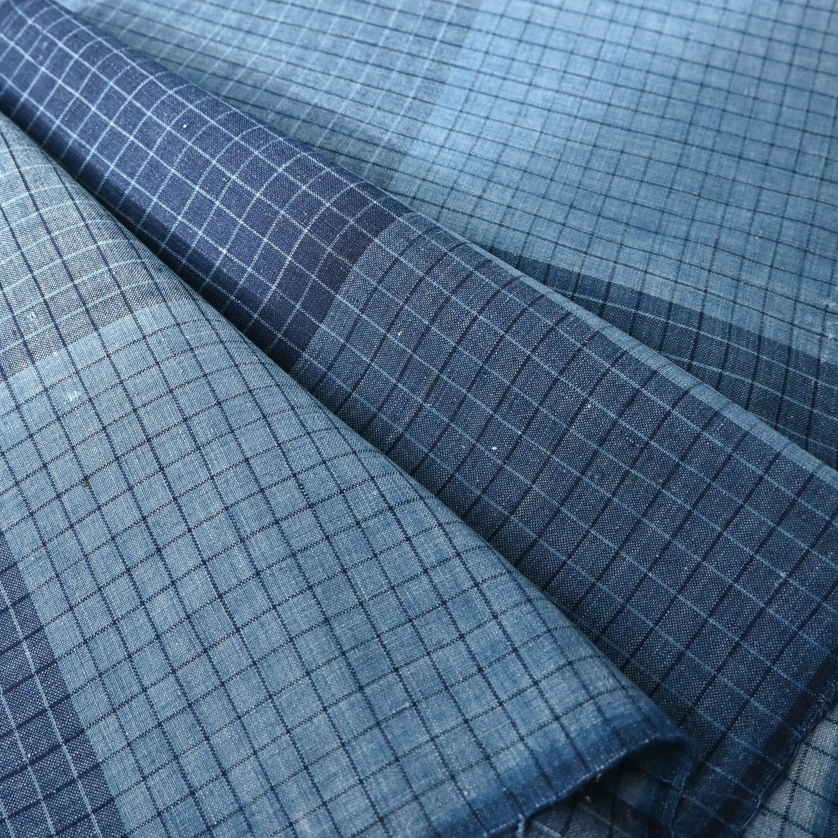 Close-up view of vintage Japanese indigo check cotton from futon cover in medium-weight.