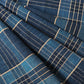 Close-up view of vintage Japanese indigo check cotton piece from old futon cover with mend.