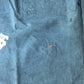 Detailed view of vintage Japanese indigo cotton furoshiki with various hand-stitched mends.