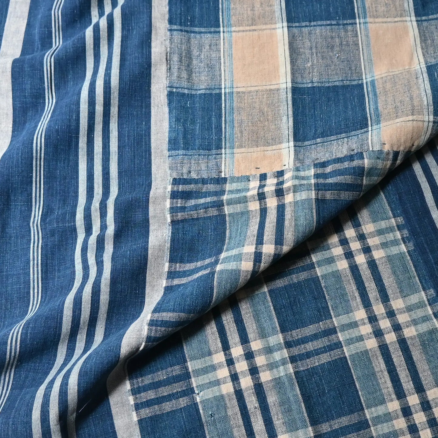 Detailed view of Vintage Japanese indigo futon cover with check and stripe from mid-20th century.