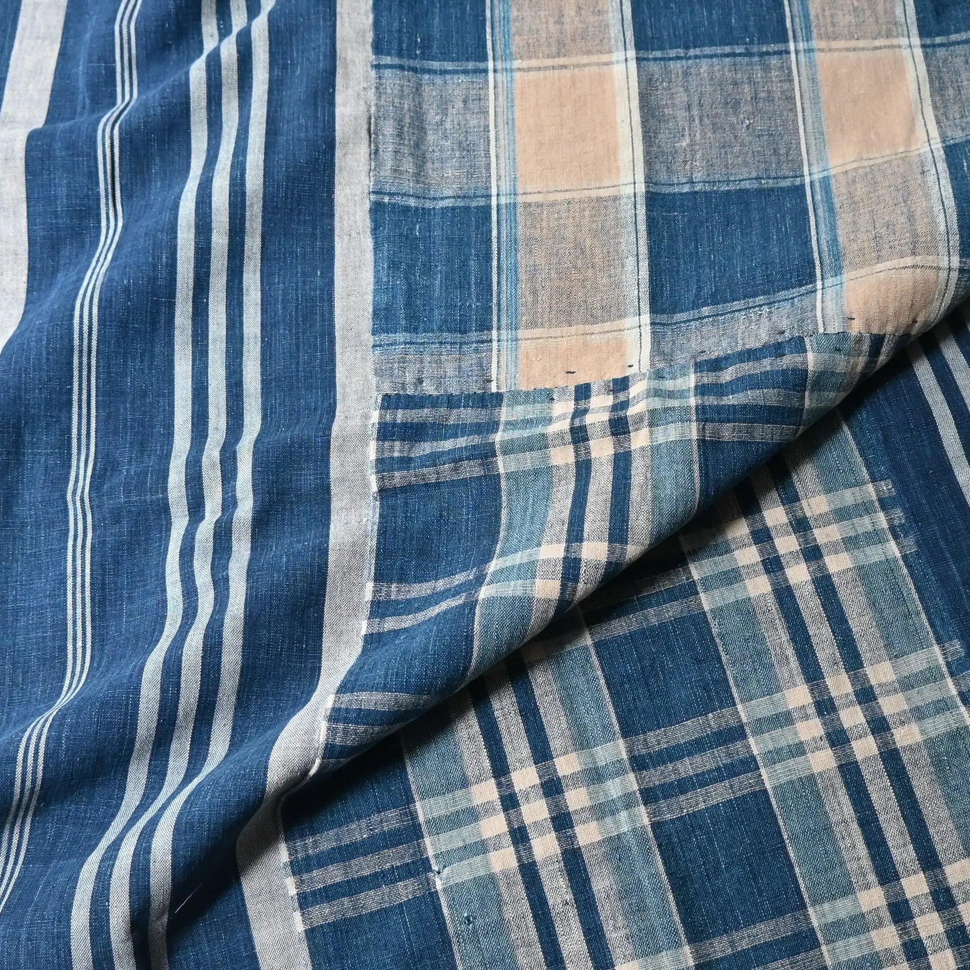 Detailed view of Vintage Japanese indigo futon cover with check and stripe from mid-20th century.