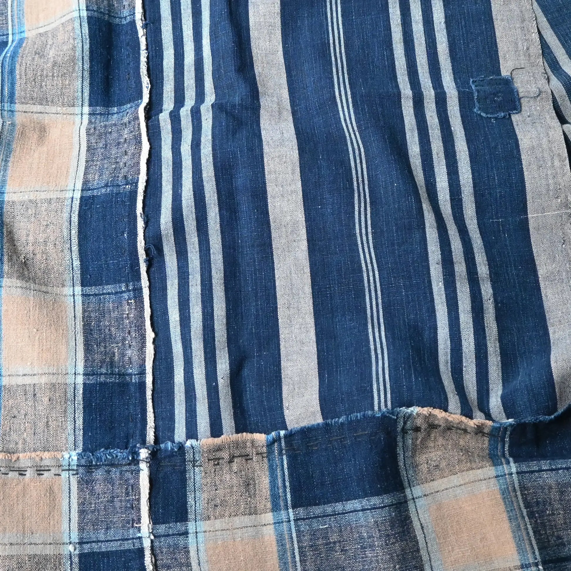 Detailed view of Vintage Japanese indigo futon cover with check and stripe from mid-20th century.