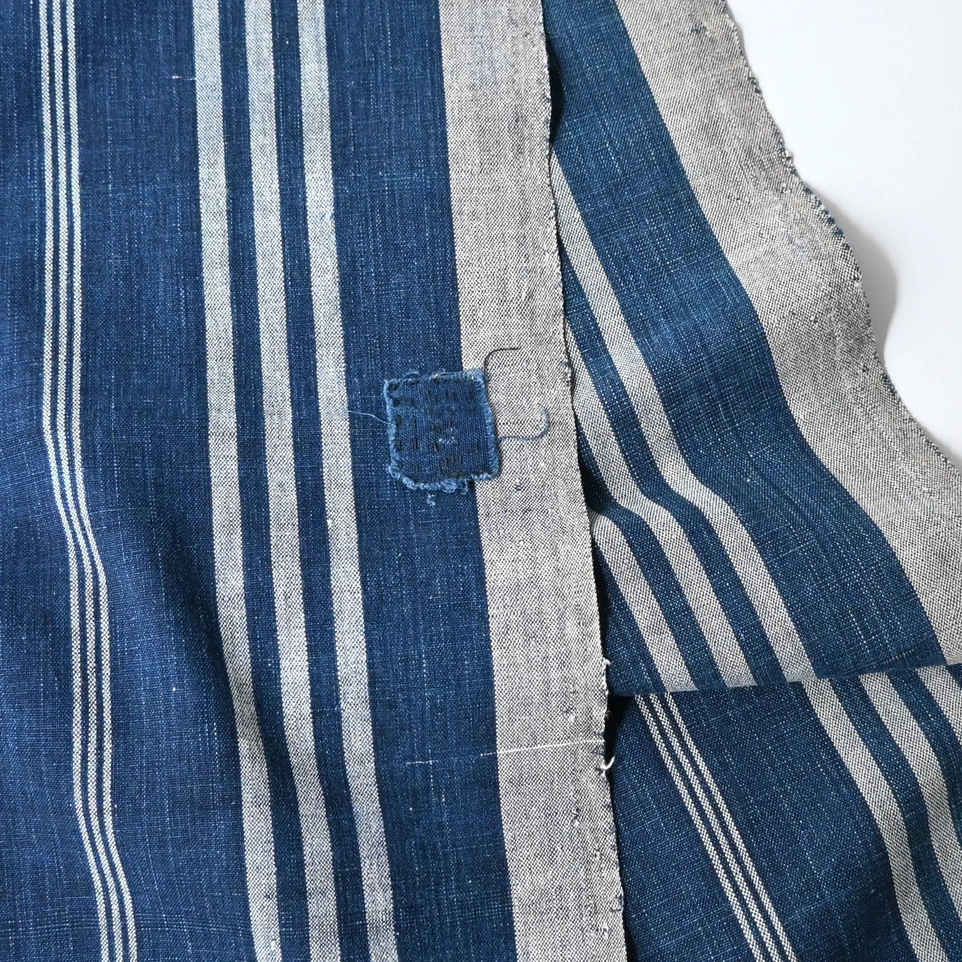 Detailed view of Vintage Japanese indigo futon cover with check and stripe from mid-20th century.
