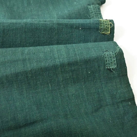 Vintage Japanese indigo green futon cover panel with some mends.