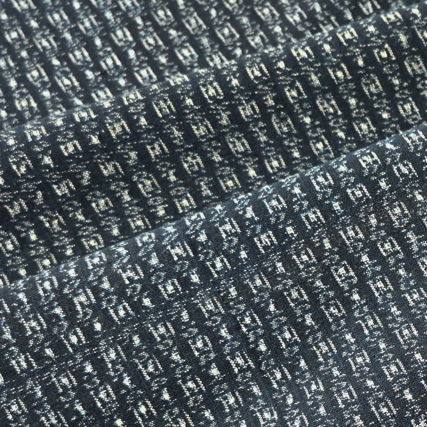 Detailed view of vintage Japanese indigo kasuri cotton piece from the mid-20th century.