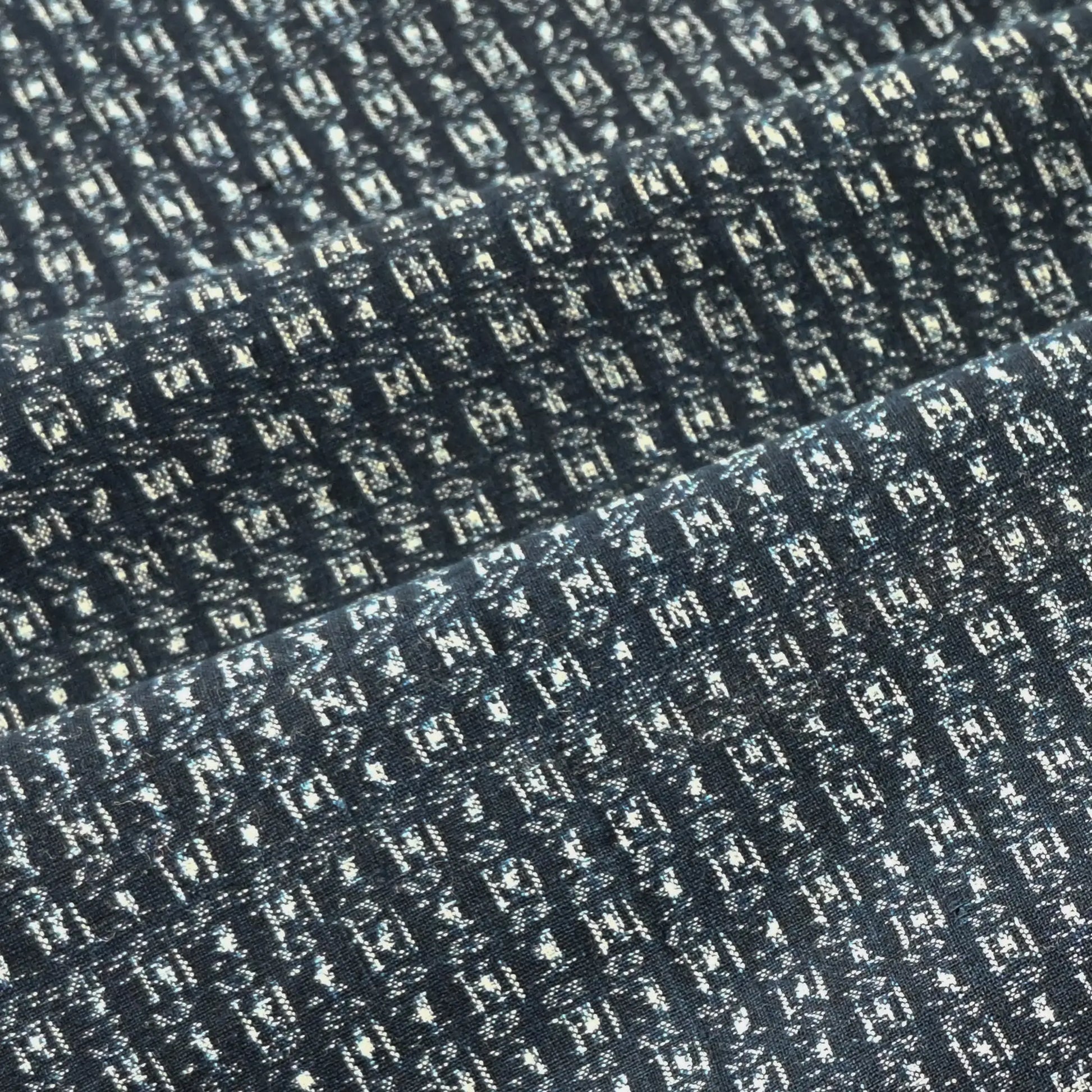 Detailed view of vintage Japanese indigo kasuri cotton piece from the mid-20th century.