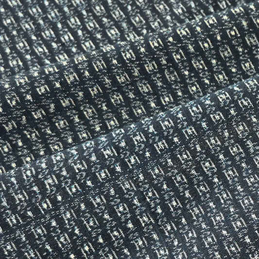 Detailed view of vintage Japanese indigo kasuri cotton piece from the mid-20th century.