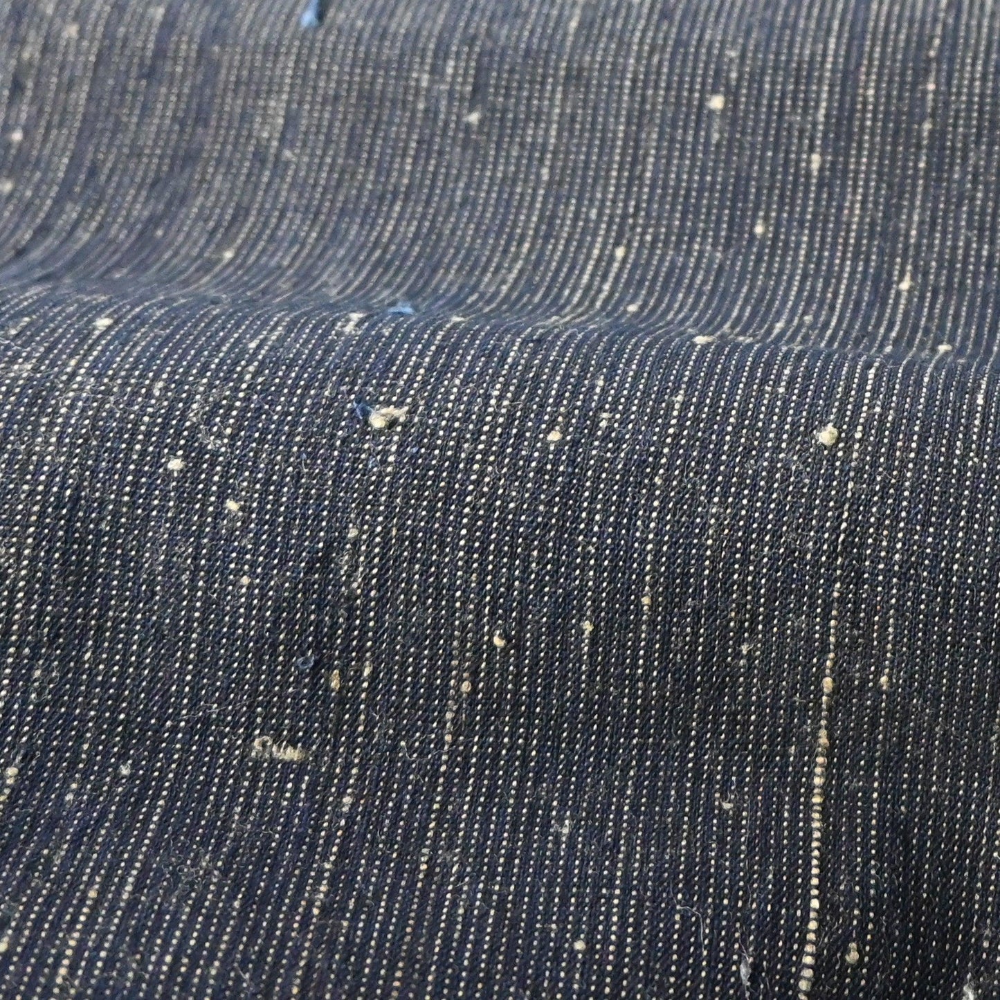 Detailed view of vintage Japanese indigo pinstripe cotton with beautiful texture.