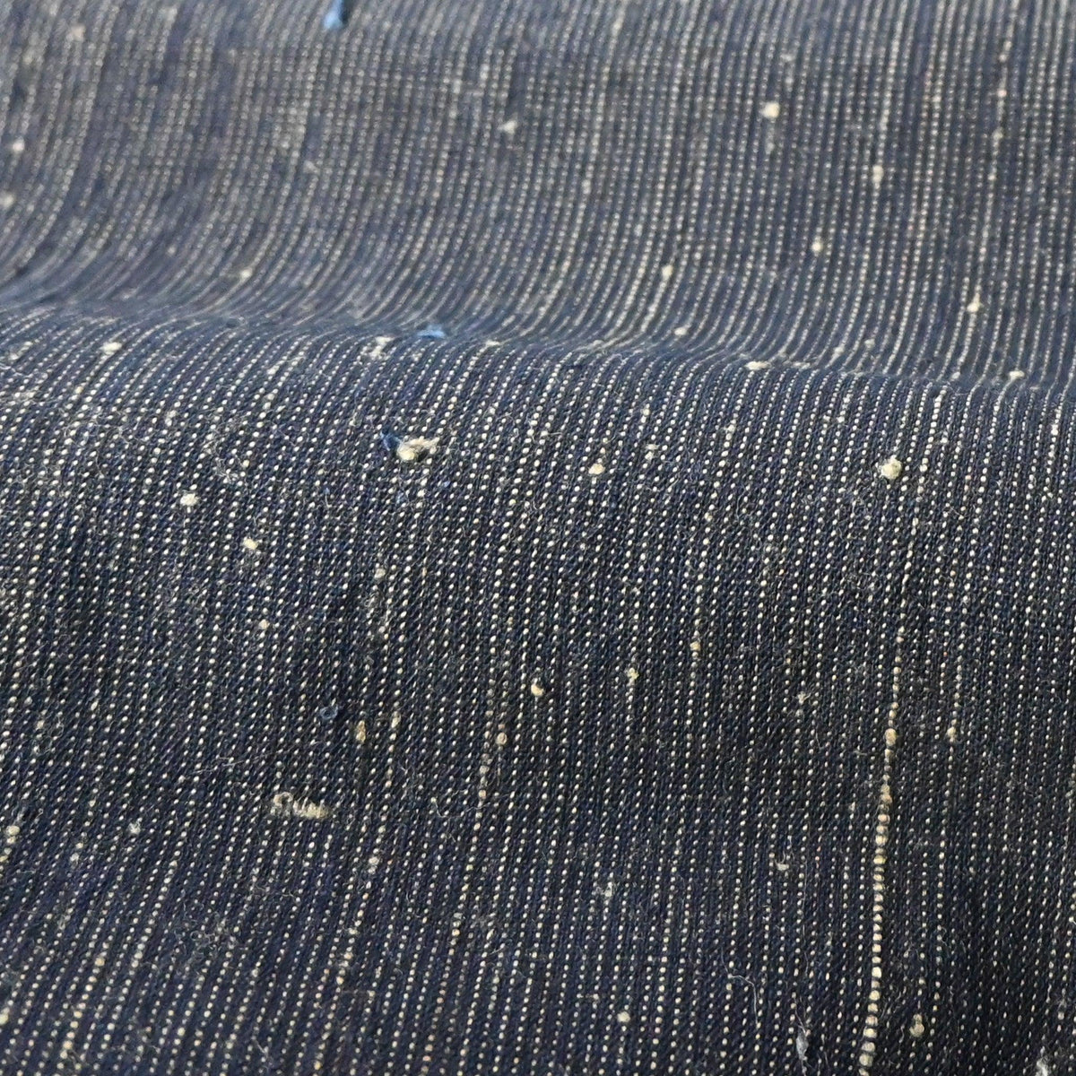 Detailed view of vintage Japanese indigo pinstripe cotton with beautiful texture.