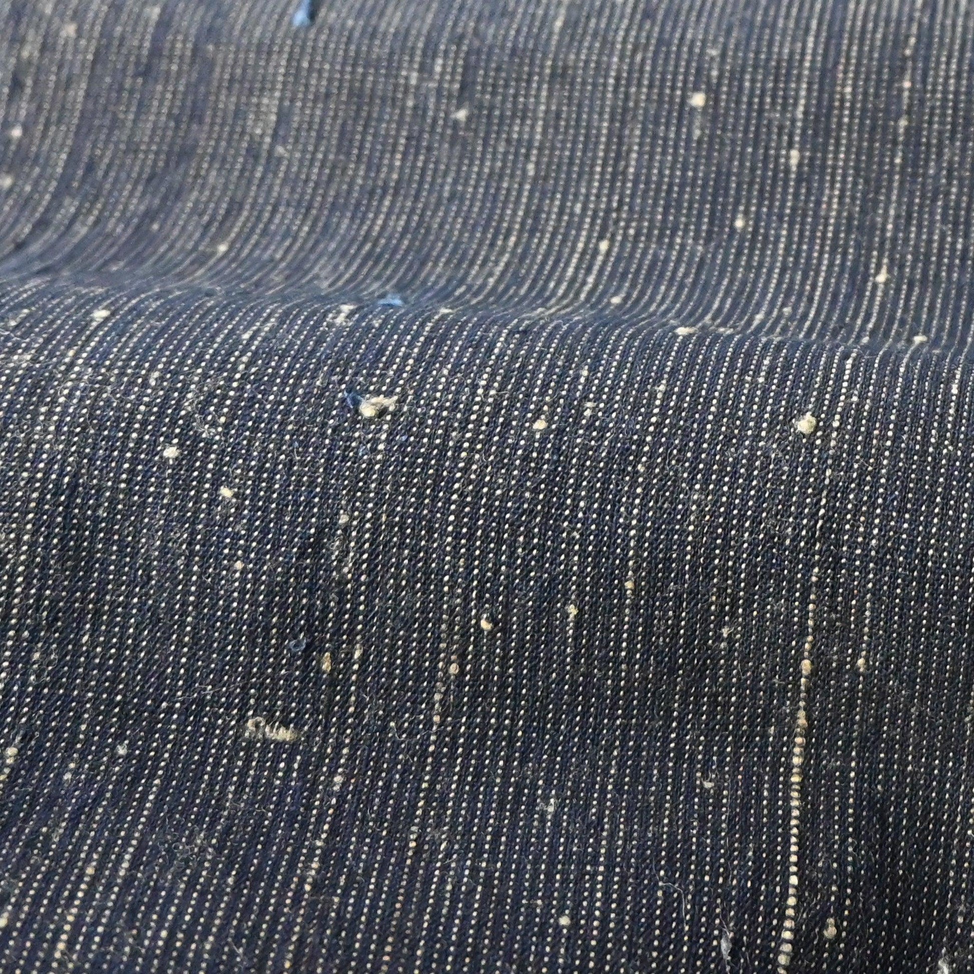 Detailed view of vintage Japanese indigo pinstripe cotton with beautiful texture.